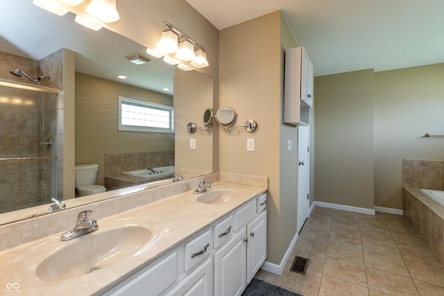 1977 Sophia Ln, Seymour, IN 47274 - bathroom with tile patterned floors, a bath, double vanity, and a tile shower