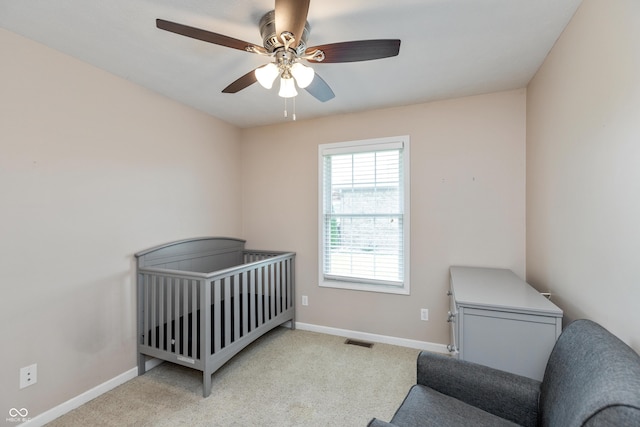 1977 Sophia Ln, Seymour, IN 47274 - carpeted bedroom with baseboards and a ceiling fan