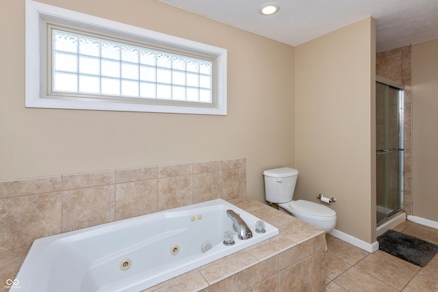 1977 Sophia Ln, Seymour, IN 47274 - bathroom featuring plenty of natural light, a whirlpool tub, tile patterned flooring, and a stall shower