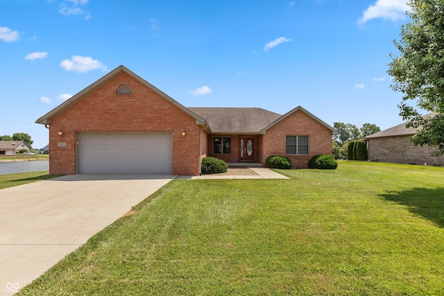 1977 Sophia Ln, Seymour, IN 47274 - ranch-style house with brick siding, concrete driveway, an attached garage, and a front yard
