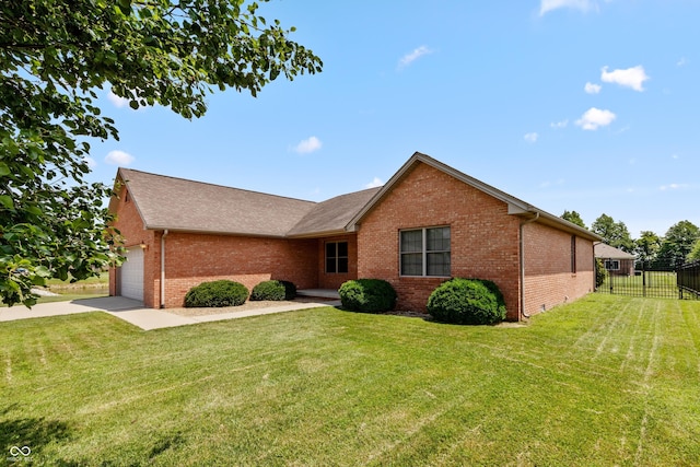 1977 Sophia Ln, Seymour, IN 47274 - view of front of house with brick siding, a garage, driveway, and roof with shingles