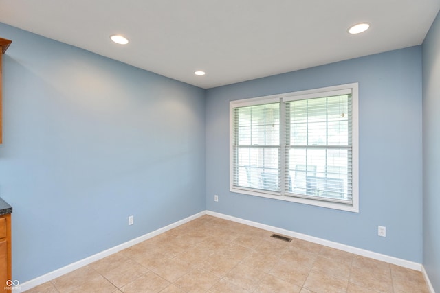 1977 Sophia Ln, Seymour, IN 47274 - empty room with recessed lighting and light tile patterned floors
