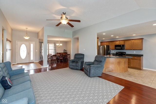 1977 Sophia Ln, Seymour, IN 47274 - living room with light wood-type flooring, a chandelier, ceiling fan, and recessed lighting
