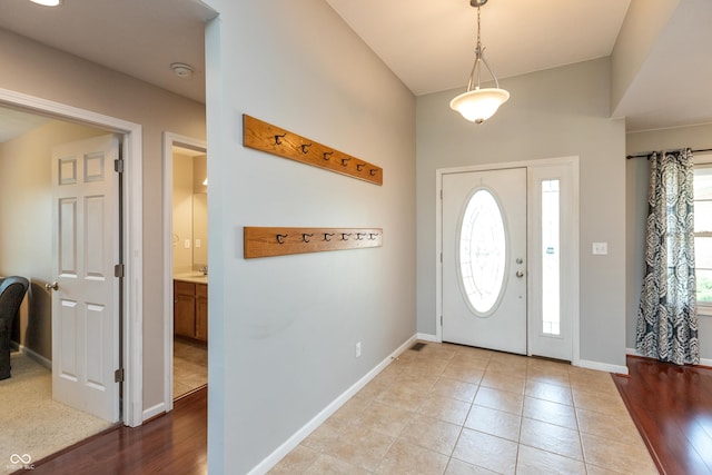 1977 Sophia Ln, Seymour, IN 47274 - foyer with healthy amount of natural light, light tile patterned floors, and lofted ceiling