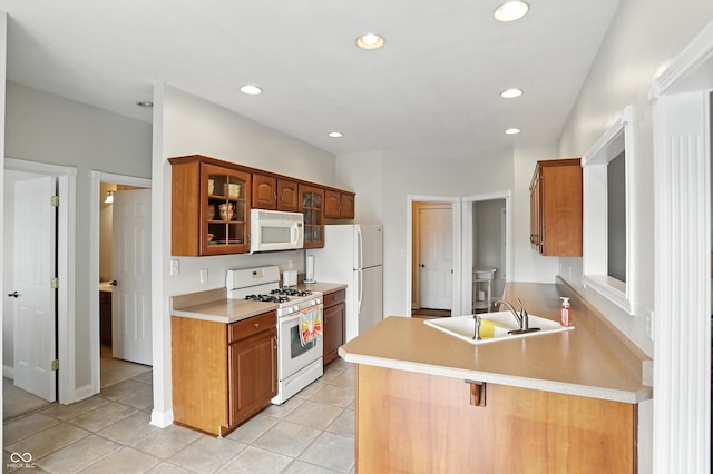 35 Decourcy Ln, Franklin, IN 46131 - kitchen featuring white appliances, glass insert cabinets, a peninsula, recessed lighting, and light tile patterned flooring