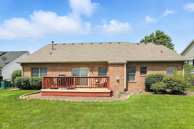 35 Decourcy Ln, Franklin, IN 46131 - rear view of house with brick siding, a deck, a shingled roof, and a yard