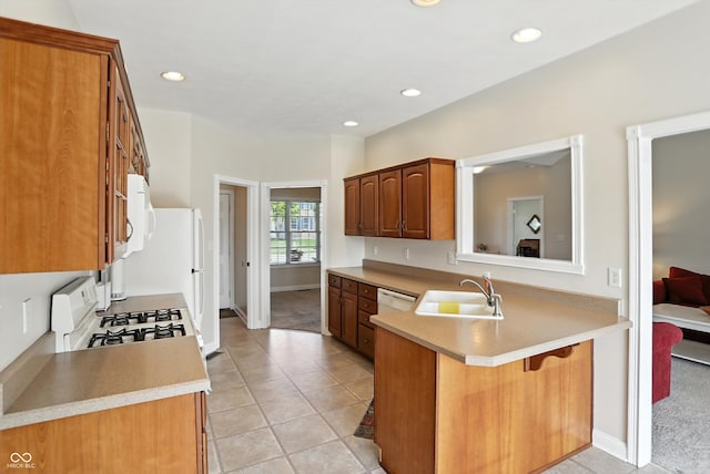 35 Decourcy Ln, Franklin, IN 46131 - kitchen with white appliances, a kitchen bar, a peninsula, light countertops, and brown cabinetry