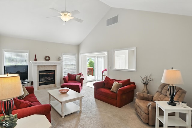 35 Decourcy Ln, Franklin, IN 46131 - living area featuring high vaulted ceiling, a tiled fireplace, carpet floors, and a ceiling fan