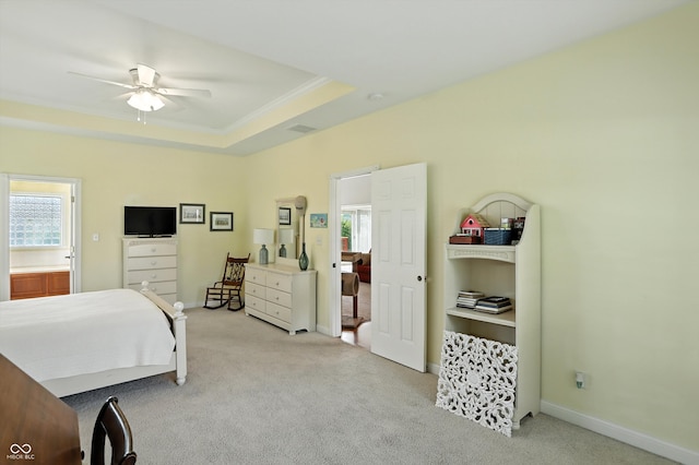 35 Decourcy Ln, Franklin, IN 46131 - bedroom with light colored carpet, ornamental molding, a tray ceiling, and ceiling fan