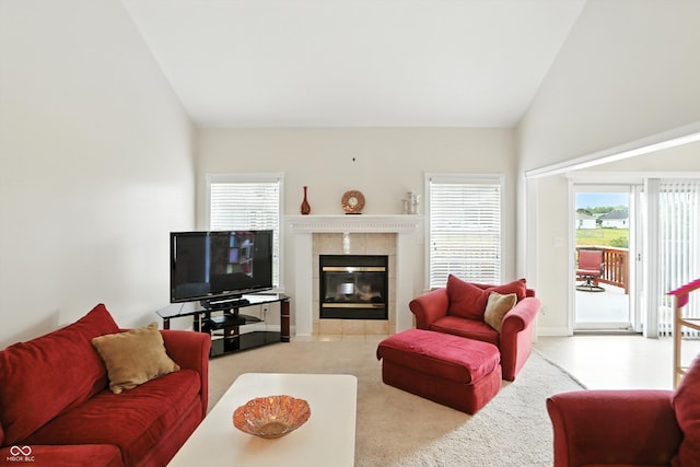35 Decourcy Ln, Franklin, IN 46131 - carpeted living area featuring plenty of natural light, a tile fireplace, and high vaulted ceiling