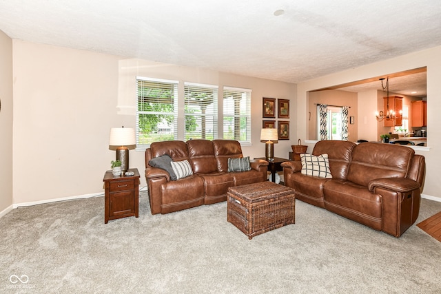 11820 Stepping Stone Dr, Fishers, IN 46037 - carpeted living area with healthy amount of natural light and a chandelier