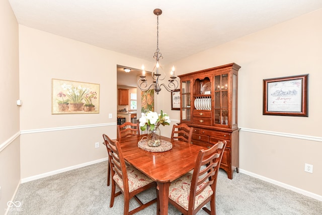 11820 Stepping Stone Dr, Fishers, IN 46037 - dining room featuring a chandelier and light carpet