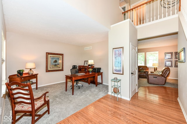 11820 Stepping Stone Dr, Fishers, IN 46037 - office area featuring wood finished floors and a high ceiling