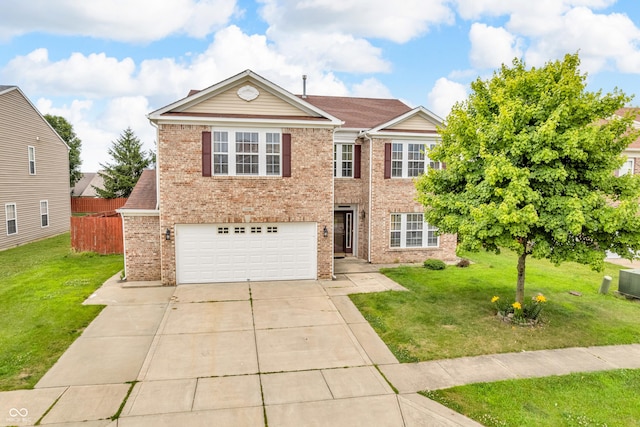 1449 Danielle Dr, Indianapolis, IN 46231 - traditional-style house with brick siding, an attached garage, and driveway
