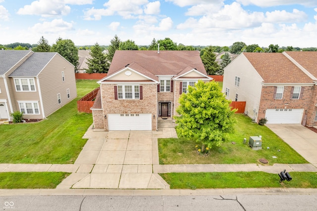 1449 Danielle Dr, Indianapolis, IN 46231 - traditional-style home with driveway, an attached garage, a residential view, and brick siding