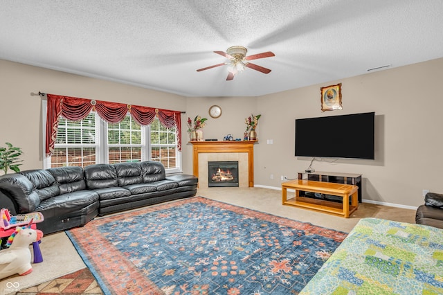1449 Danielle Dr, Indianapolis, IN 46231 - living room with ceiling fan, a tile fireplace, and a textured ceiling