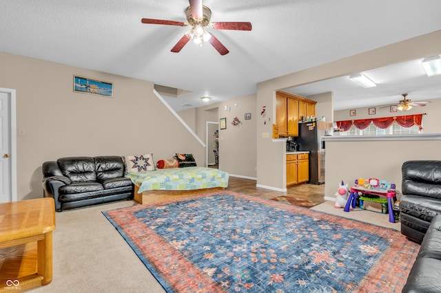 1449 Danielle Dr, Indianapolis, IN 46231 - living area featuring a ceiling fan, stairs, a textured ceiling, and light carpet