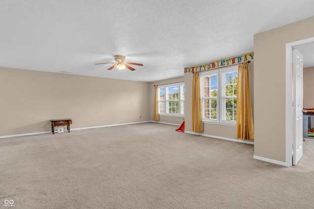 1449 Danielle Dr, Indianapolis, IN 46231 - empty room with a ceiling fan, light colored carpet, and a textured ceiling