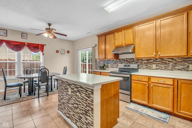 1449 Danielle Dr, Indianapolis, IN 46231 - kitchen featuring stainless steel electric range oven, under cabinet range hood, a ceiling fan, tasteful backsplash, and a textured ceiling