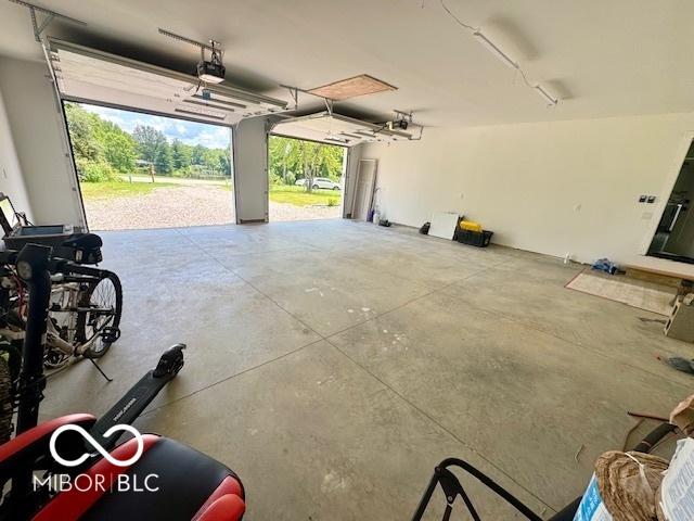 339 Honey Locust Pl, North Vernon, IN 47265 - garage featuring a garage door opener