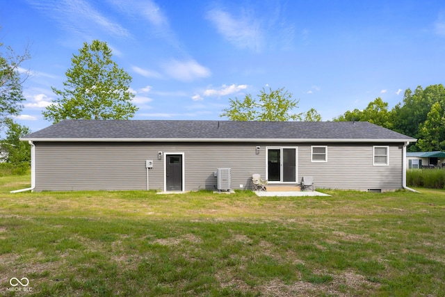 339 Honey Locust Pl, North Vernon, IN 47265 - rear view of house with entry steps, a lawn, and roof with shingles