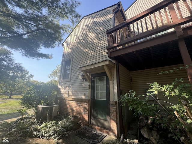 9552 Maple Way, Indianapolis, IN 46268 - view of side of property featuring a central AC unit and brick siding