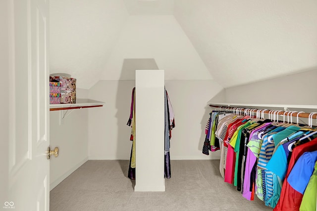 5761 Coopers Hawk Dr, Carmel, IN 46033 - spacious closet featuring carpet flooring and vaulted ceiling