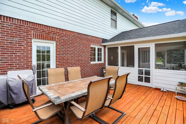 5761 Coopers Hawk Dr, Carmel, IN 46033 - wooden terrace featuring outdoor dining area, a sunroom, and a grill