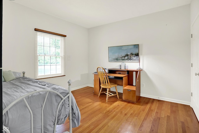 5761 Coopers Hawk Dr, Carmel, IN 46033 - bedroom with light wood-type flooring and baseboards