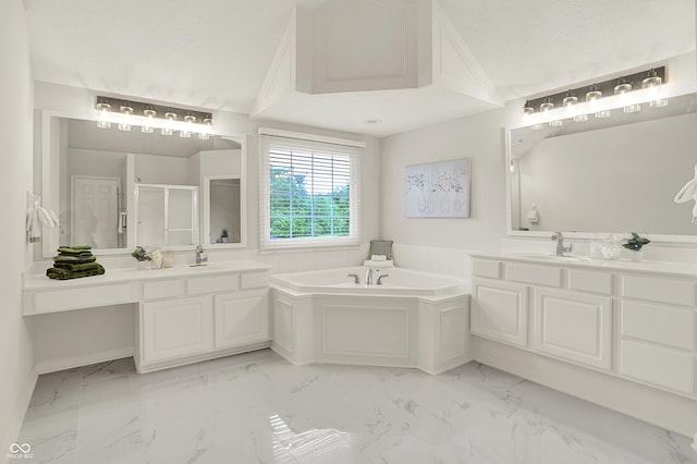 5761 Coopers Hawk Dr, Carmel, IN 46033 - bathroom with a stall shower, marble look tiles, a garden tub, two vanities, and a textured ceiling