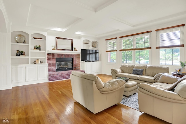 5761 Coopers Hawk Dr, Carmel, IN 46033 - living room featuring light wood finished floors, a brick fireplace, coffered ceiling, beam ceiling, and built in shelves