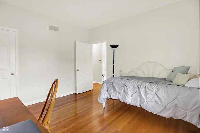 5761 Coopers Hawk Dr, Carmel, IN 46033 - bedroom with wood finished floors and baseboards