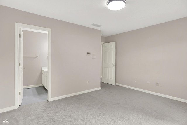 5761 Coopers Hawk Dr, Carmel, IN 46033 - unfurnished bedroom featuring light carpet and connected bathroom
