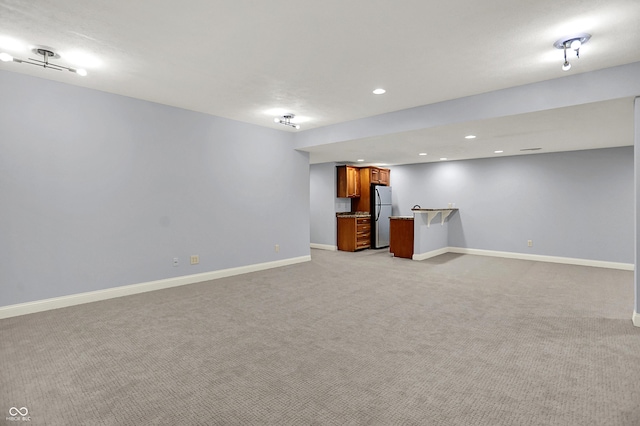 2263 Glebe St, Carmel, IN 46032 - finished below grade area featuring freestanding refrigerator, light carpet, wet bar, and recessed lighting