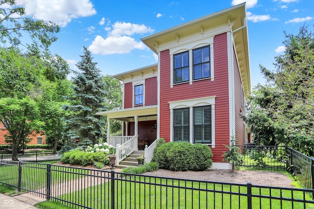 2263 Glebe St, Carmel, IN 46032 - italianate house featuring a porch