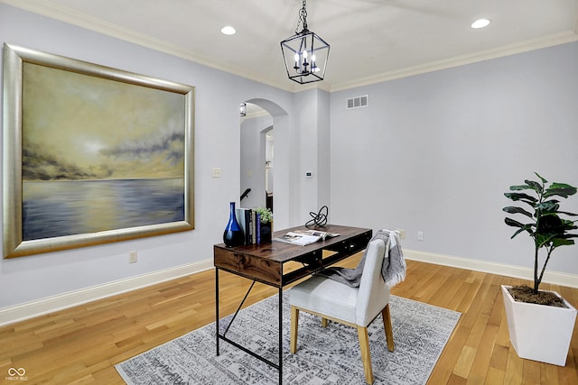 2263 Glebe St, Carmel, IN 46032 - office area with arched walkways, light wood finished floors, recessed lighting, crown molding, and a chandelier