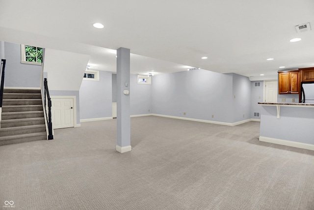 2263 Glebe St, Carmel, IN 46032 - finished basement featuring refrigerator, light colored carpet, recessed lighting, and stairs