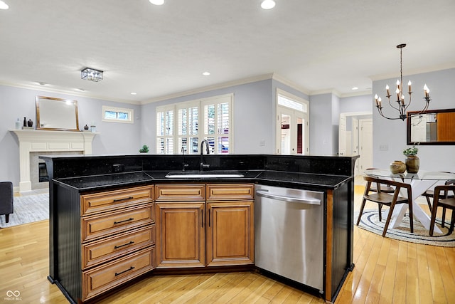 2263 Glebe St, Carmel, IN 46032 - kitchen featuring dishwasher, a glass covered fireplace, a chandelier, light wood-type flooring, and ornamental molding