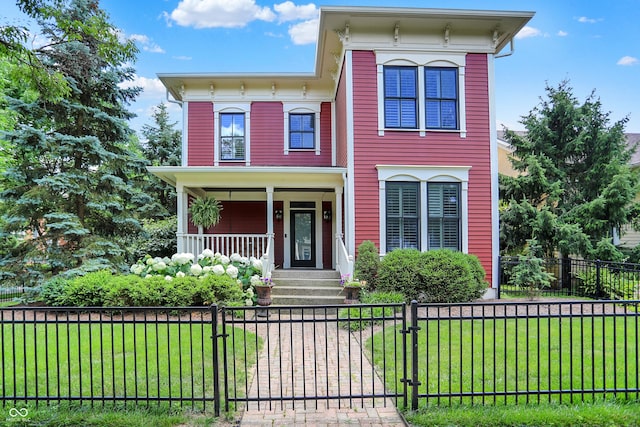 2263 Glebe St, Carmel, IN 46032 - italianate house with covered porch, a fenced front yard, and a gate