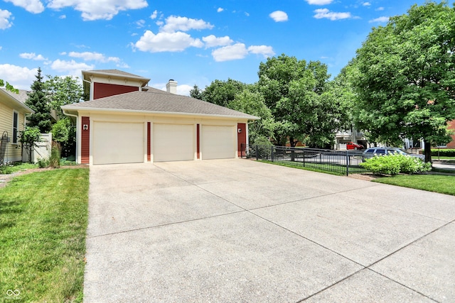 2263 Glebe St, Carmel, IN 46032 - view of side of home with a detached garage and a chimney