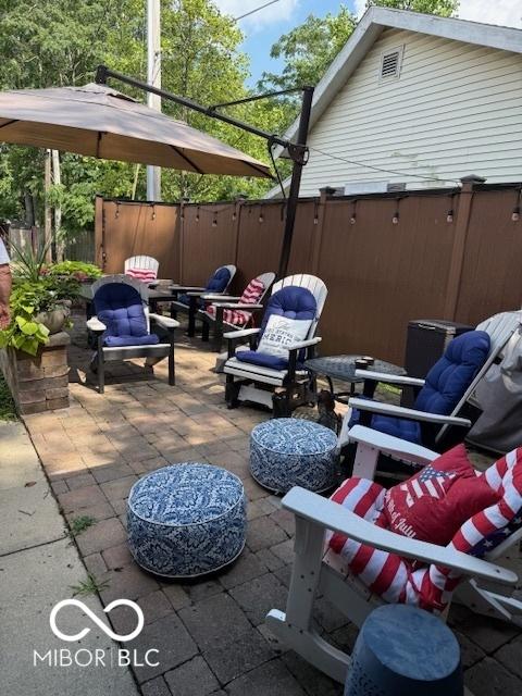 18 Hough St, Greenfield, IN 46140 - view of patio / terrace featuring an outdoor living space