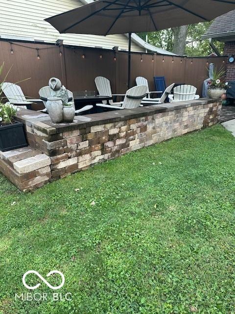 18 Hough St, Greenfield, IN 46140 - entry to storm shelter with a lawn and a patio