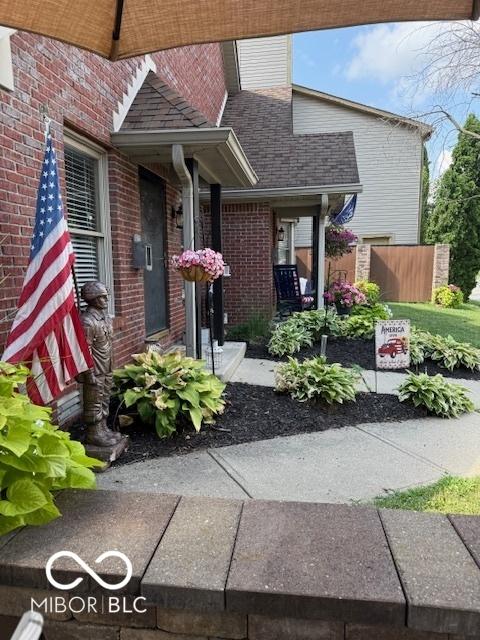 18 Hough St, Greenfield, IN 46140 - view of front of property featuring brick siding and a shingled roof