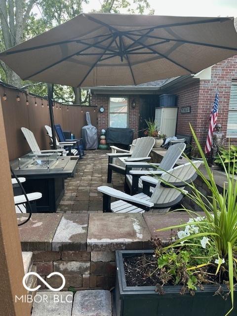 18 Hough St, Greenfield, IN 46140 - view of patio / terrace with a fire pit and a grill