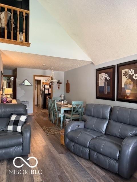 18 Hough St, Greenfield, IN 46140 - living room featuring a chandelier, wood finished floors, and high vaulted ceiling