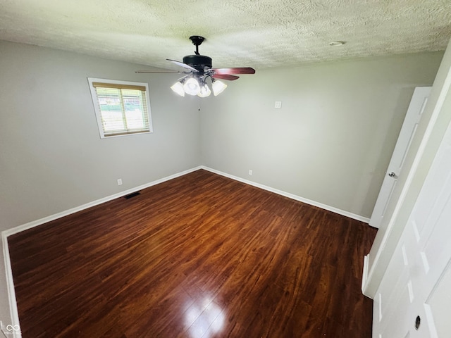 1345 S Biltmore Ave, Indianapolis, IN 46241 - empty room with dark wood-style floors, a ceiling fan, and a textured ceiling