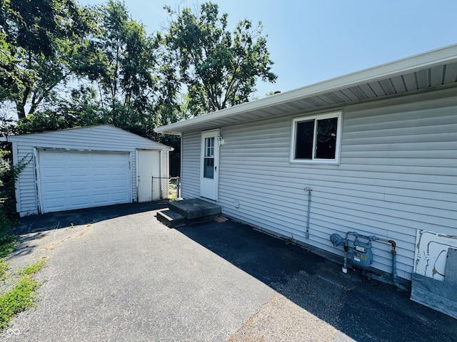 1345 S Biltmore Ave, Indianapolis, IN 46241 - view of home's exterior featuring a garage and an outbuilding
