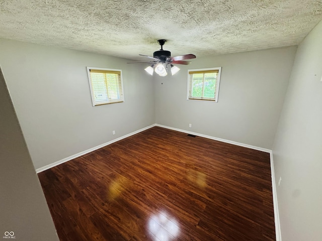 1345 S Biltmore Ave, Indianapolis, IN 46241 - empty room featuring healthy amount of natural light, a ceiling fan, wood finished floors, and a textured ceiling