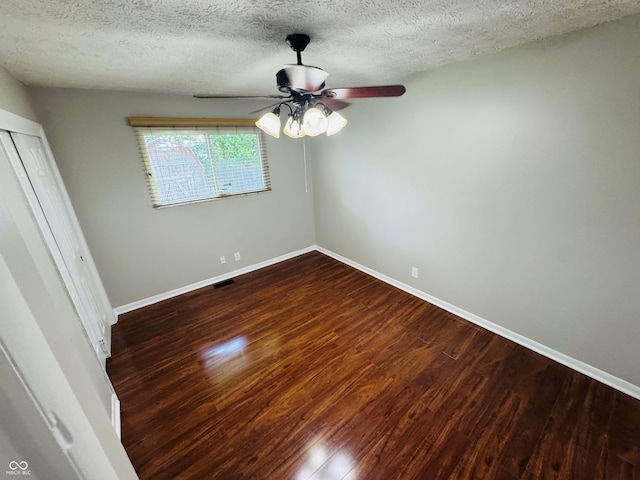 1345 S Biltmore Ave, Indianapolis, IN 46241 - unfurnished bedroom featuring a textured ceiling, wood finished floors, a closet, and ceiling fan