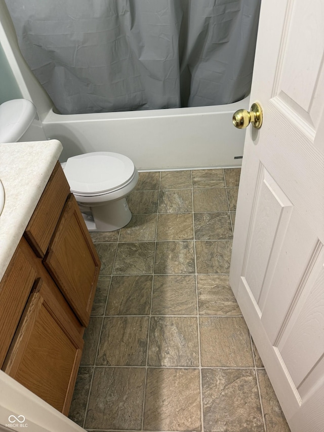 2929 Tuscarora Ln, Indianapolis, IN 46217 - bathroom with stone finish floors, shower / bathtub combination with curtain, and vanity